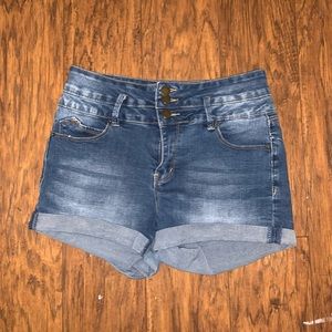High waisted blue denim shorts.